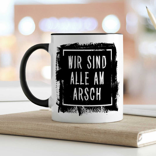 Bedruckte Tasse mit Spruch - "Wir sind alle am Arsch"